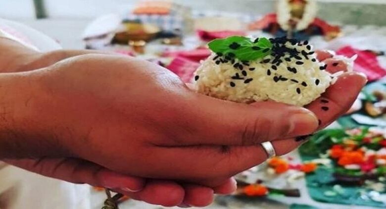 handful of rice and leaves as an offering  (a part of the Pitru Paksh Ritual)